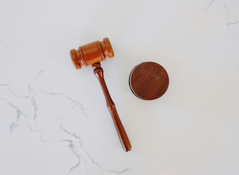 Wooden gavel on a marble surface