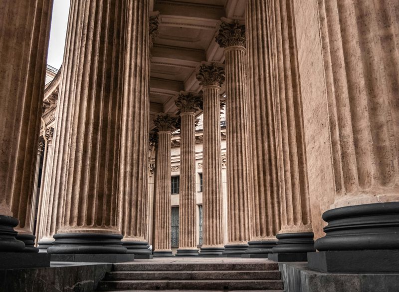 Stone staircase leading through classical columns