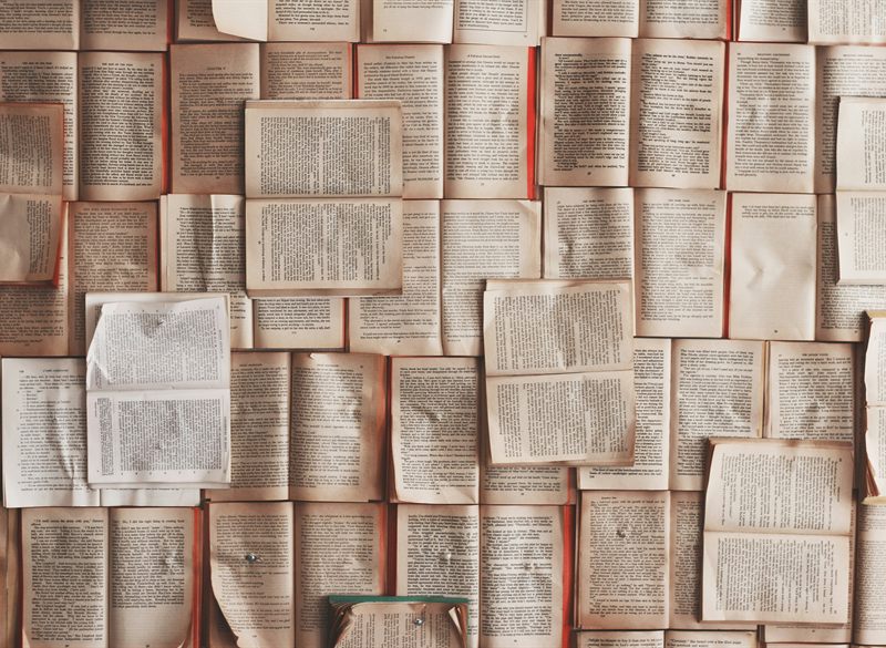 Wall covered with open book pages