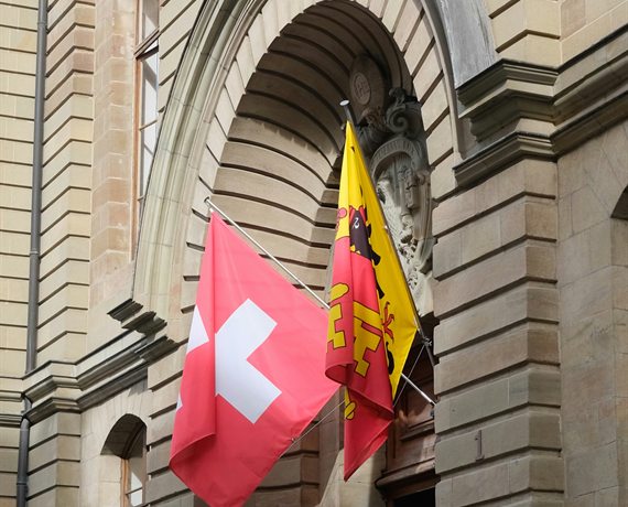 Palais de Justice in Geneva with Swiss and Geneva flags